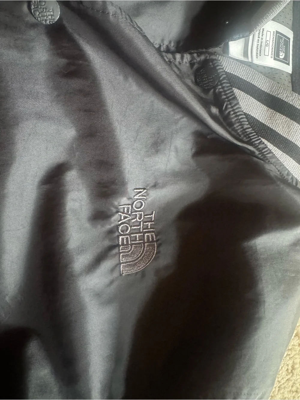 The North Face Black Bomber Jacket with Gray/Black Striped Trim
